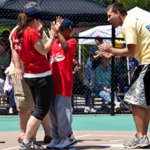 Coach cheering on player